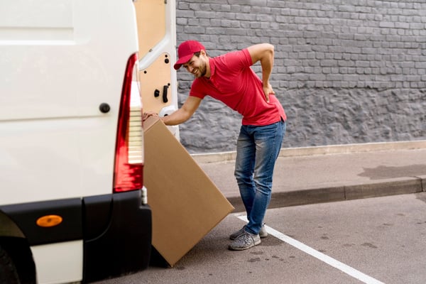 delivery-man-loading-car-with-package-1